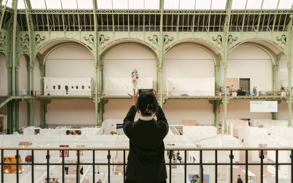 A lady clicking photo with her phone