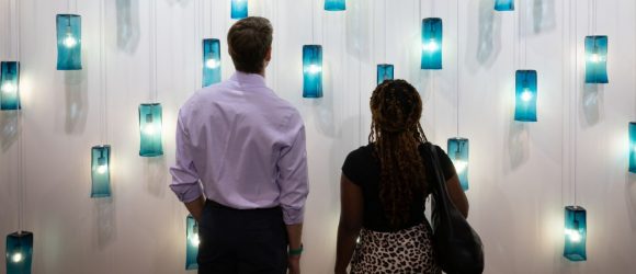Man and woman looking at art wall