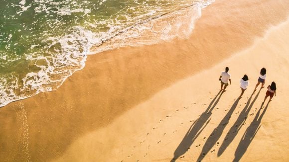 Family walking on beach