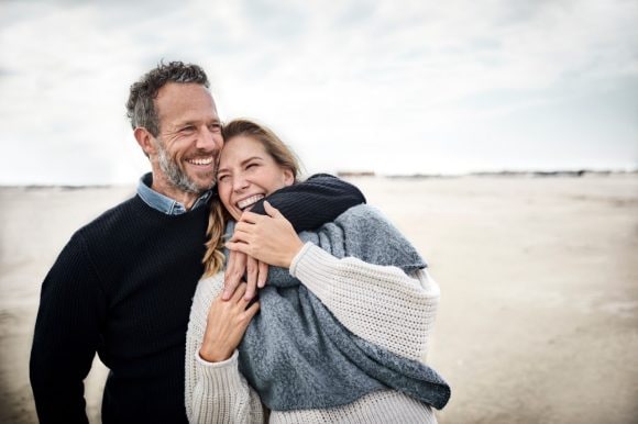 Couple standing on beach