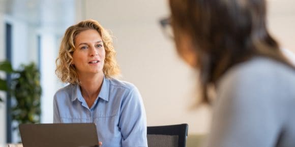 Two women in office with laptop