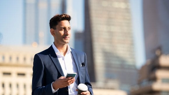 business man holding phone