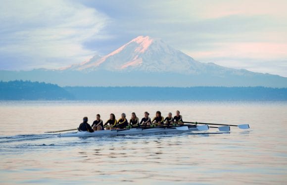 Rowing crew on water