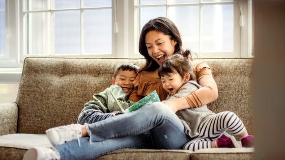 woman and kids reading