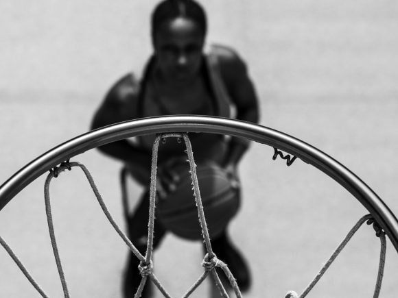 basket ball player looking at basket