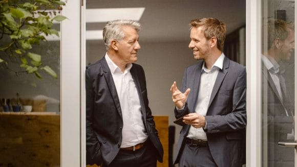 Two businessmen talking
