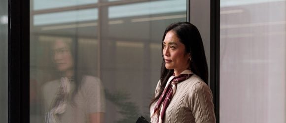 Businesswoman in front of window