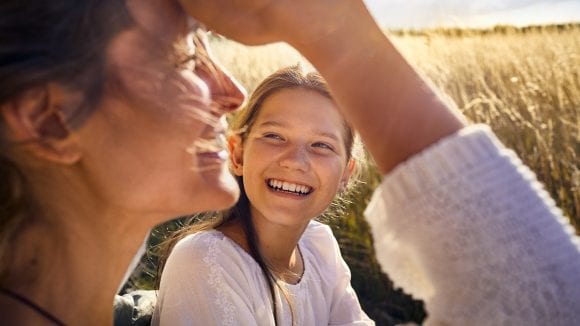 girl with mother on field