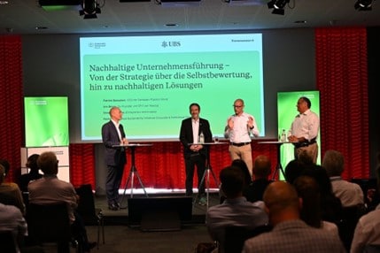 Four men presenting at the conference