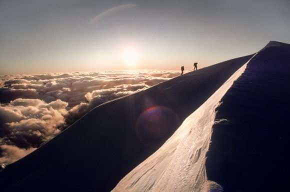 Mountaineers climbing mountain