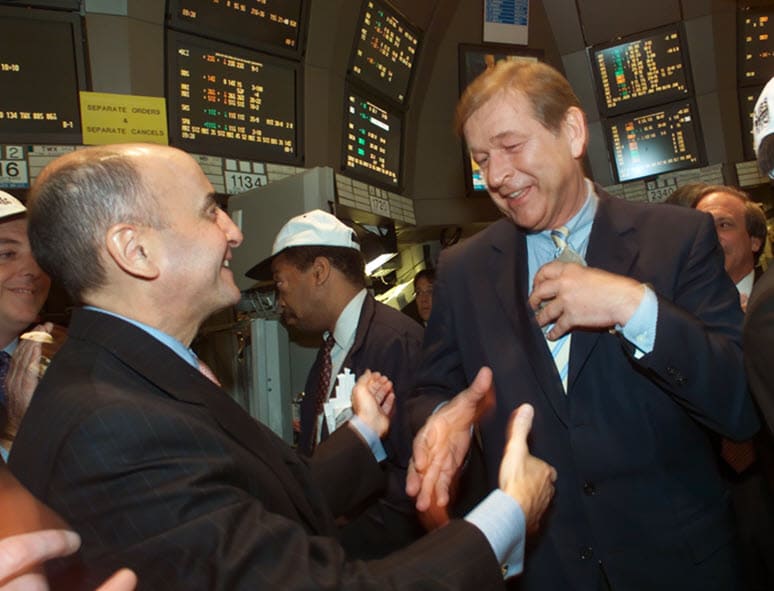 Marcel Ospel, right, CEO of UBS AG, gets a congratulatory handshake from New York Stock Exchange Chairman Richard Grasso as shares of the bank begin trading on exchange Tuesday May 16, 2000
