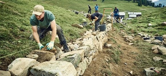 The picture shows people doing volunteering.