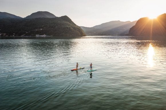 Man and woman paddling on water