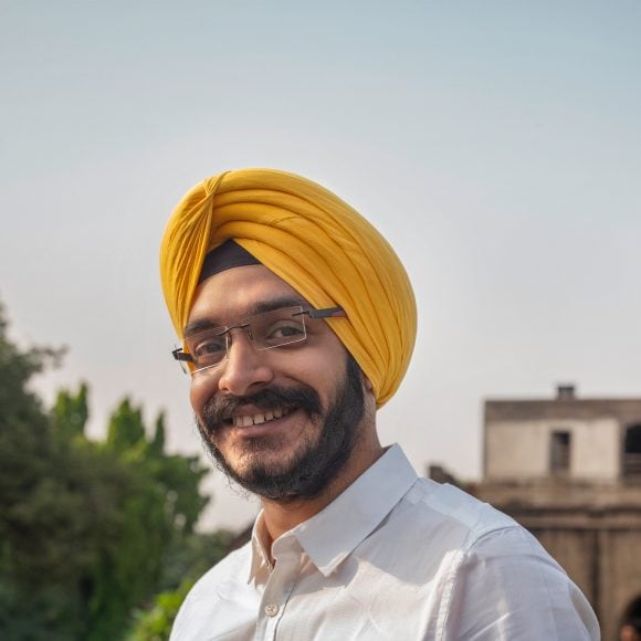 Portrait of smiling Indian man with beard and turban