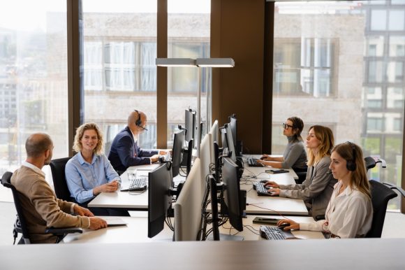 Group of employees sitting at desk