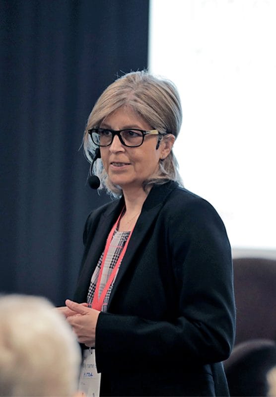 Mitra presenting on the stage