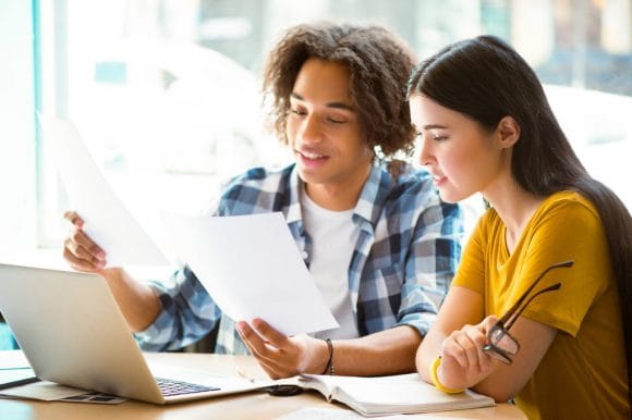 Two friends discussing about project