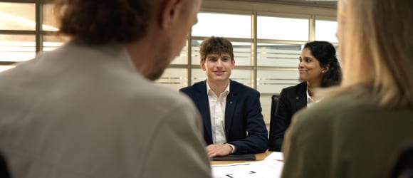 Group of people sitting around a table