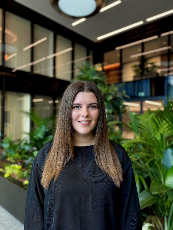 Portrait of Poppy, advanced apprenticeship participant in Group Finance