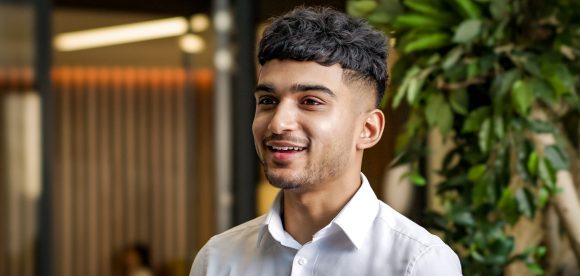 Young man standing in office