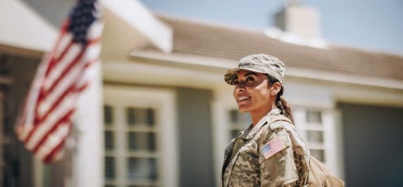 Women in uniform with American flag in the background