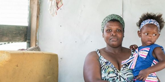 A woman holding a child.