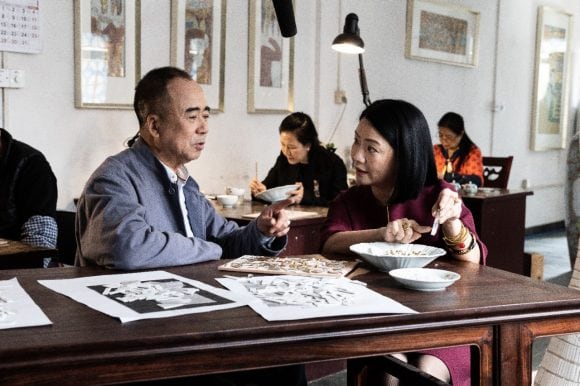 Chinese couple disucssing about some art