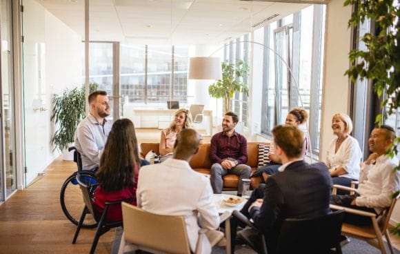 Diverse group of colleagues working together around the table.