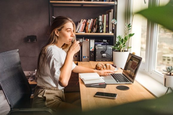 Woman working with laptop at home