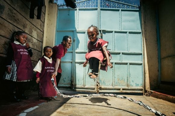 A group of children playing on a chain