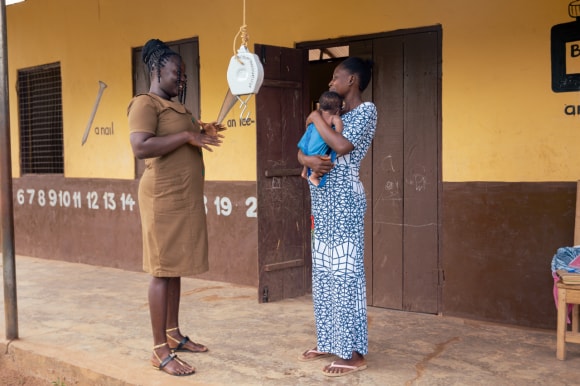 A mother and her baby seek care from a healthcare provider