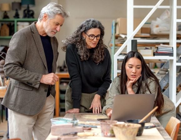 Group of people discussing artwork