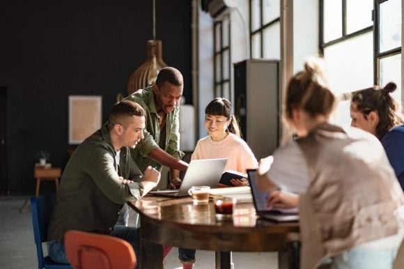Diverse team having meeting in open workspace