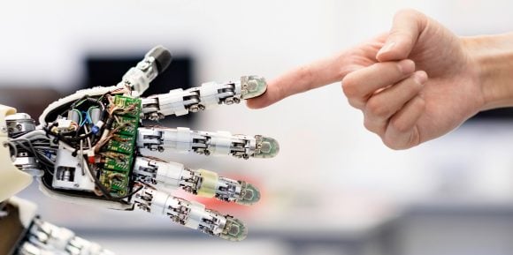 Touching fingers with a robot