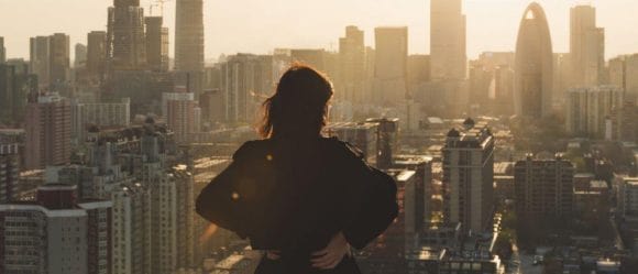 Woman staring at a city