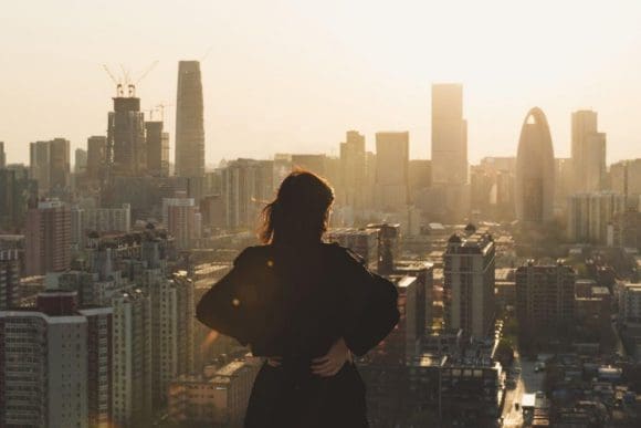 Woman staring at a city