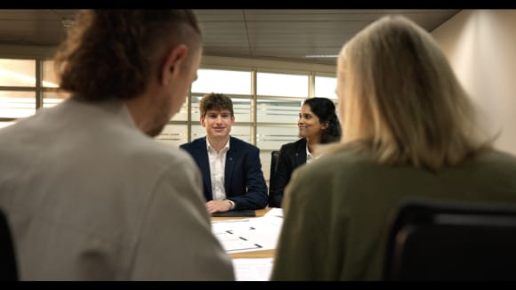 Group of people sitting around a table