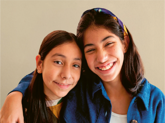 Two girls smiling