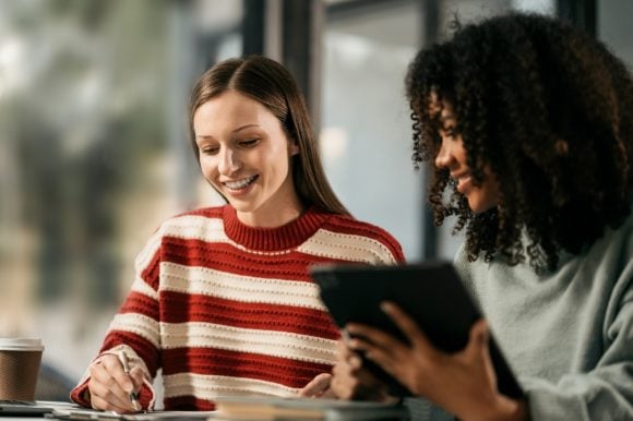 Two girls are studying