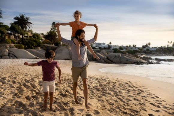 People and cabs crossing crossroads
