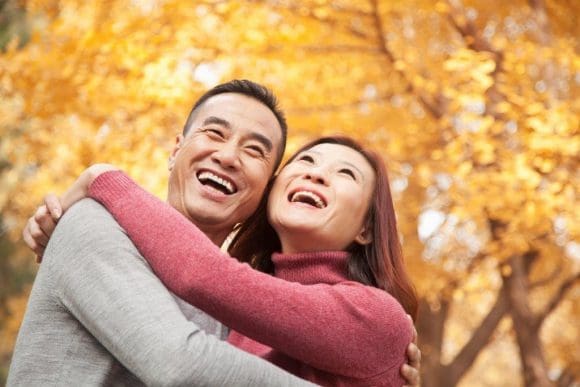 Senior asian couple laughing