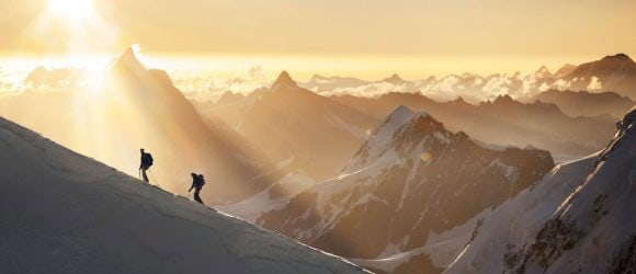 Mountaineers on snowy ridge of Monte Rosa mountain