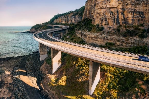 Car on an elevated road near the sea