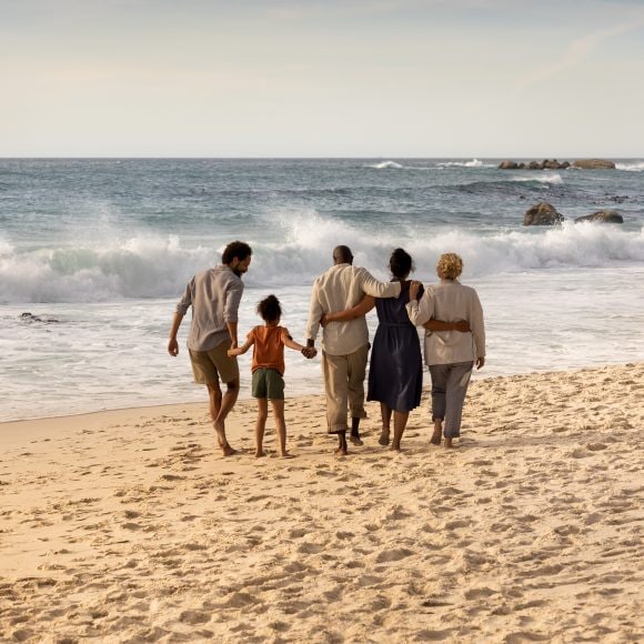 Family walking on beach