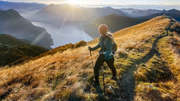Woman hiking along mountain ridge