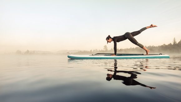 Women yoga surf board