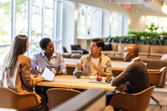 Group of people having meeting in office space