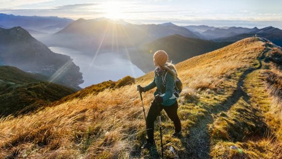 Woman hiking along mountain ridge
