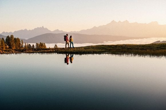 Man and woman at mountain lake