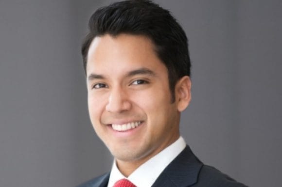 Photo of Robert Cruz smiling at camera